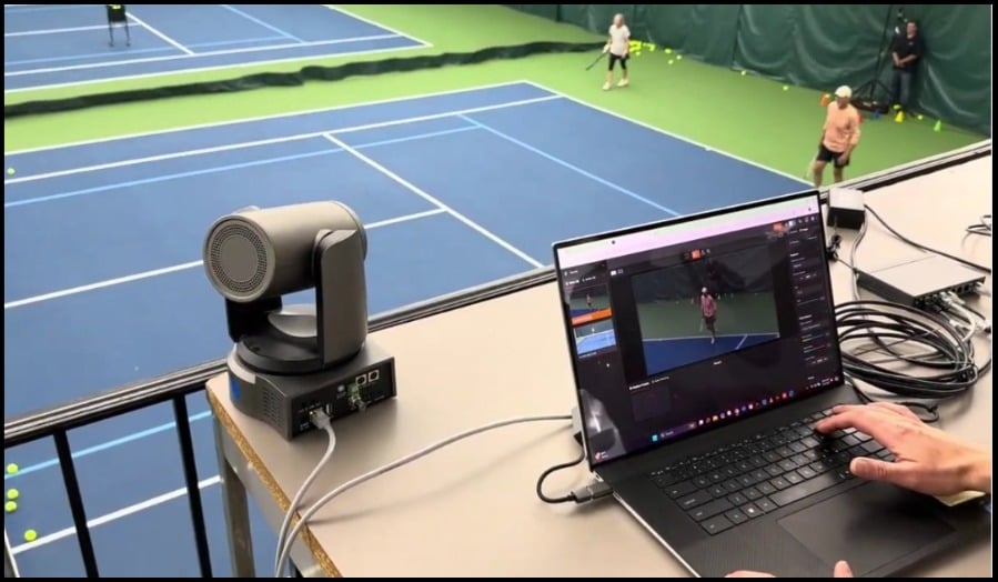 Elevated PTZ cameras on balcony area for tennis match.